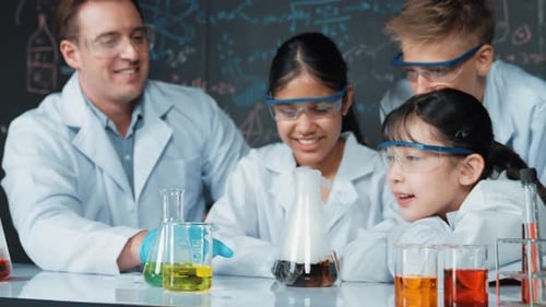 Enthusiastic Students Watching Science Experiment with Teacher