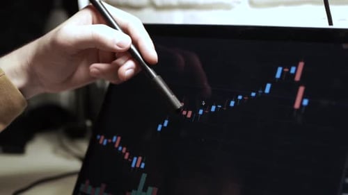 Trading stocks online. Man working on laptop in the office Mykyta_15