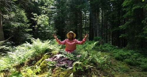 Female Person Relaxing Outdoors in Peaceful Green Landscape In Harmony