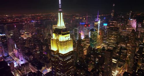 Fascinating Empire State building with lighted top at night. Striking scenery of New York