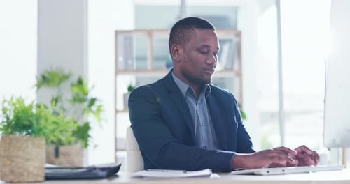 Serious, business and black man typing on computer, keyboard and network update for web planning