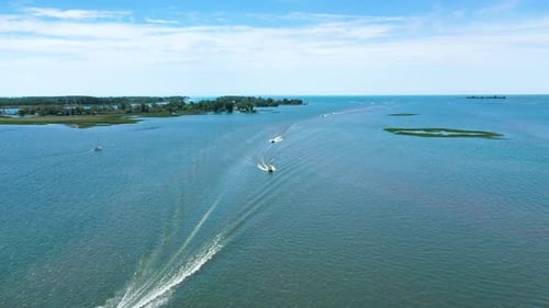 Powerboats Speeding Across Lake on a Sunny Day