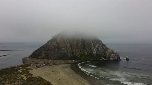 Morro Rock in California from the Fog on a Summer Day with a Drone