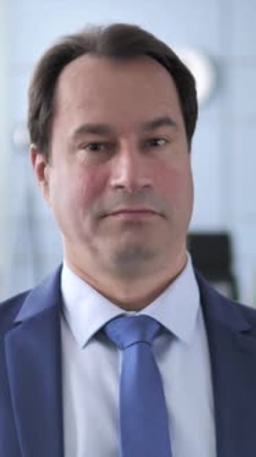 Professional Man in Blue Suit Looking at Camera