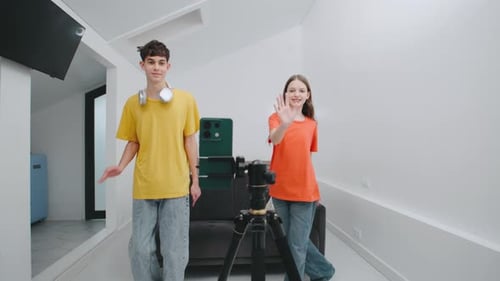 Smiling Teens Record Video Together on Cell Phone