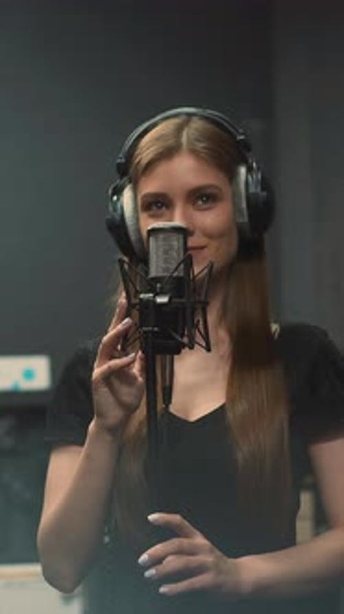 Singer Recording Music in a Studio