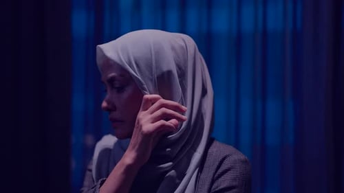 Woman in Hijab Crying at Night