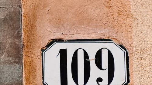 Number 109 (one hundred and nine) Affixed to a Building