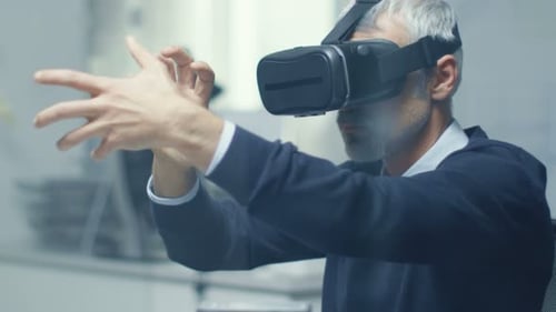 IT Engineer Working with Virtual Reality Headset On. He Works in His Modern and Minimalistic Office