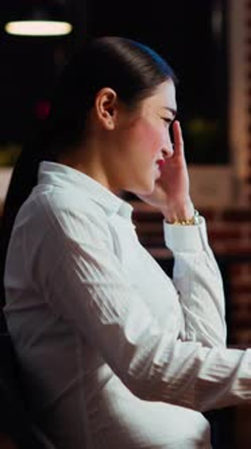 Vertical Video Businesswoman Concerned About Statistical Data Financial Graphs on Laptop