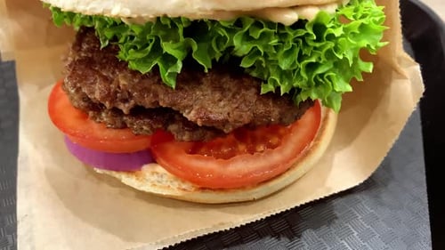 Beef Burger with Fresh Ingredients in Front of Camera Delicious Hamburger with Grilled Beef Steak