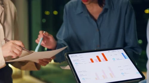 Asia businesspeople meeting plan analysis statistics brainstorm at office night.