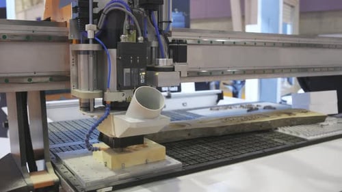 An Automatic Machine Carves a Structure Inside an Object in an Exhibition