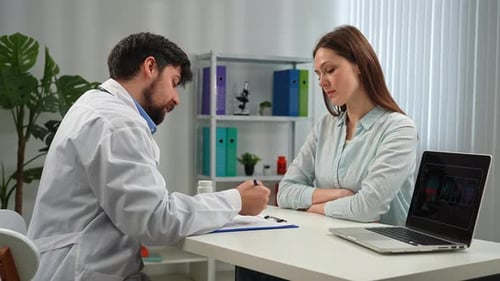 Doctor and Patient Discussing Medical Diagnosis in Office