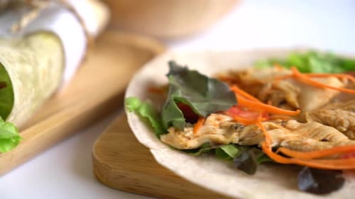 Close-Up of Delicious Wraps on Wooden Platter