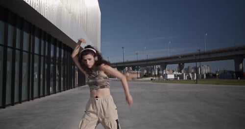 Flexible Young Dancer Performing in City