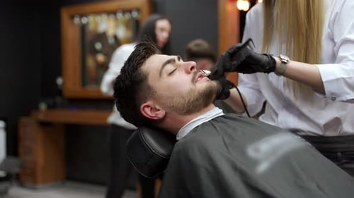 Bearded Man Getting Beard Trim at Barbershop
