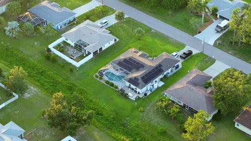 Outdoor Swimming Pool on Florida House Backyard with Outside Lanai Enclosure Covering Having Fun in