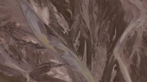 Abstract aerial view of braided river channels in arid land