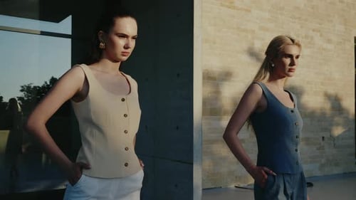 Two Women Posing in Stylish Urban Setting