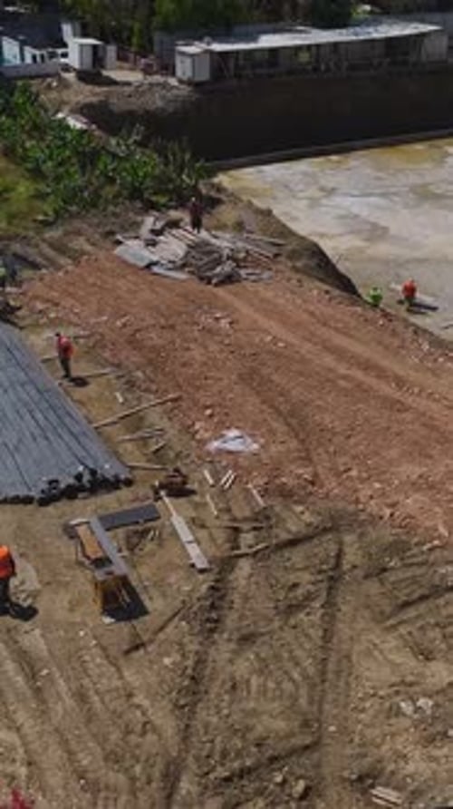Aerial View of Construction Site with Workers