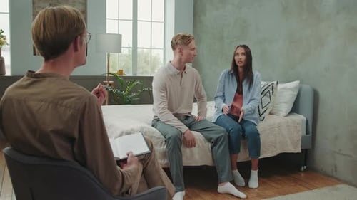 Multiracial Couple Quarreling at a Psychologist Appointment