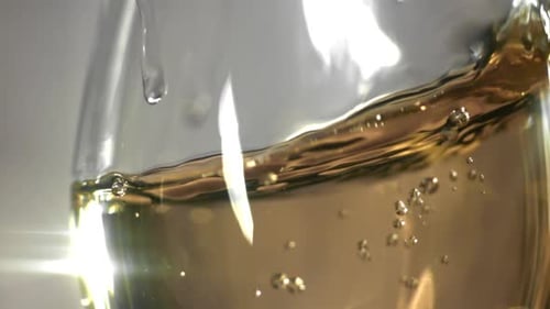 White Wine in a Glass Filmed on a Highspeed Camera at 1000 Fps