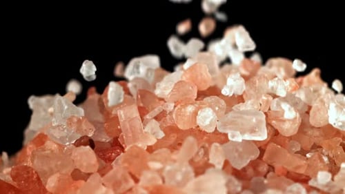 Pink Salt Falls on the Table Filmed on a Highspeed Camera at 1000 Fps