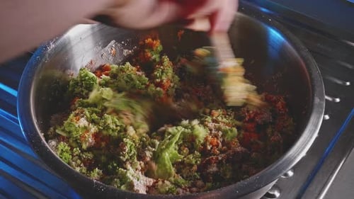 Mixing Fresh Ingredients Together in Kitchen Bowl