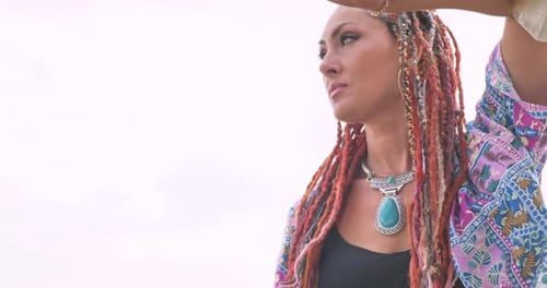 Stylish Woman with Braided Hair and Turquoise Jewelry