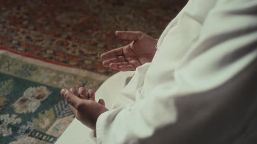 Hands of Anonymous Muslim Counting Prayers on Phalanges
