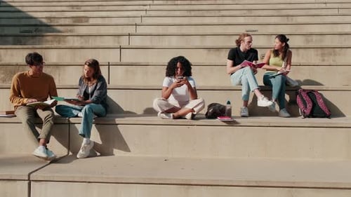 Students Study Together Outdoors on Concrete Steps