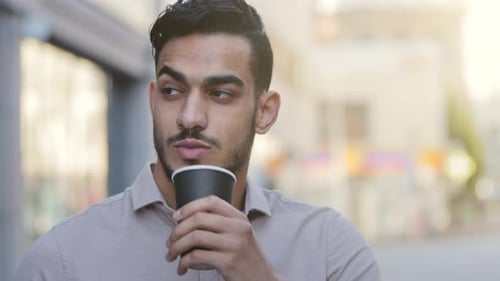 Close Up Portrait 30s Bearded Hispanic Indian Man Standing in City Street Looking Around Thoughtful