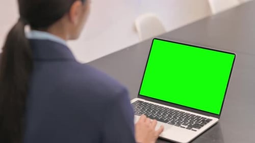 Businesswoman Using Laptop with Green Screen