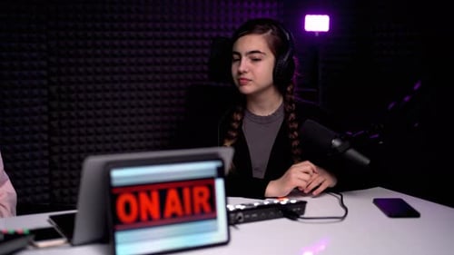 Young Female Podcaster Working in Modern Studio