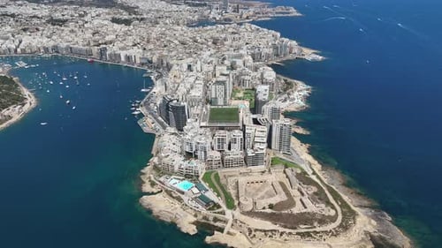 Aerial view of Sliema city. Buildings, apartments, blue sky, Mediterranean sea. Malta island