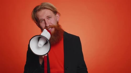 Man Speaking Into a Megaphone on Orange Background