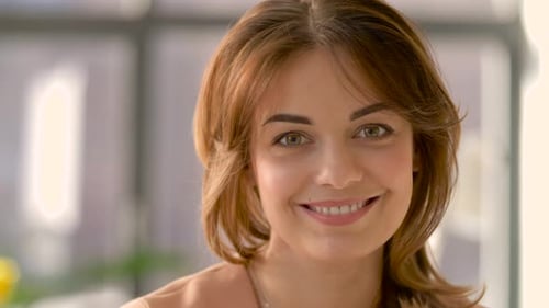 Smiling Woman Close Up Portrait with Auburn Hair