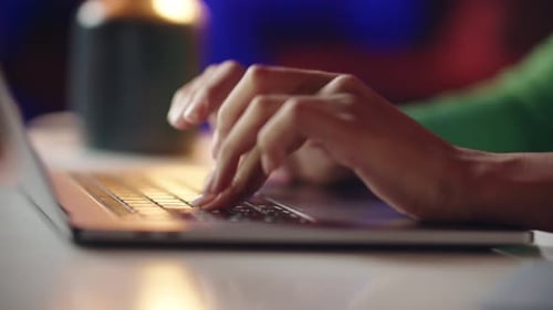 Close Up of Hands Typing on Laptop