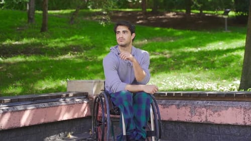 Very thoughtful disabled individual in slow motion.