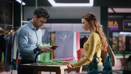 Clothing Store Assistant Selling Clothes Making Checkout Cashier Counter Closeup