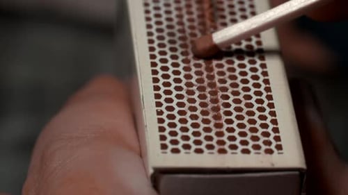Striking a Match on a Matchbox, Close Up