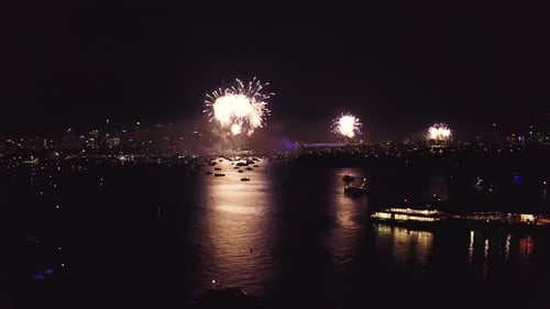 4k aerial drone footage of a firework display at the harbour at night