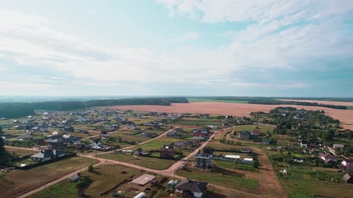 Aerial View of Large Village with Modern Houses with Courtyards and Outbuildings Beautiful Summer