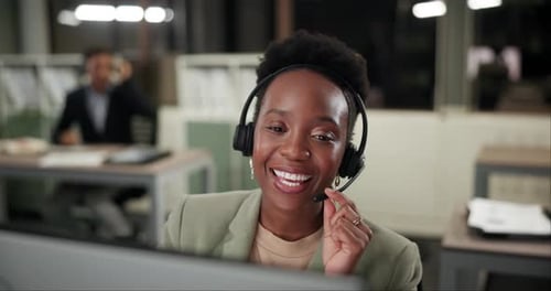 Woman, call center and talk at night in office, computer and technical support or helpdesk