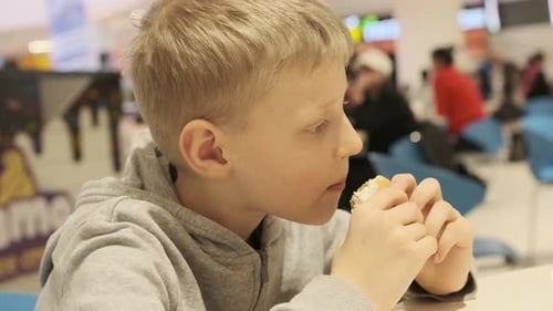 Cute Boy Eating Burger