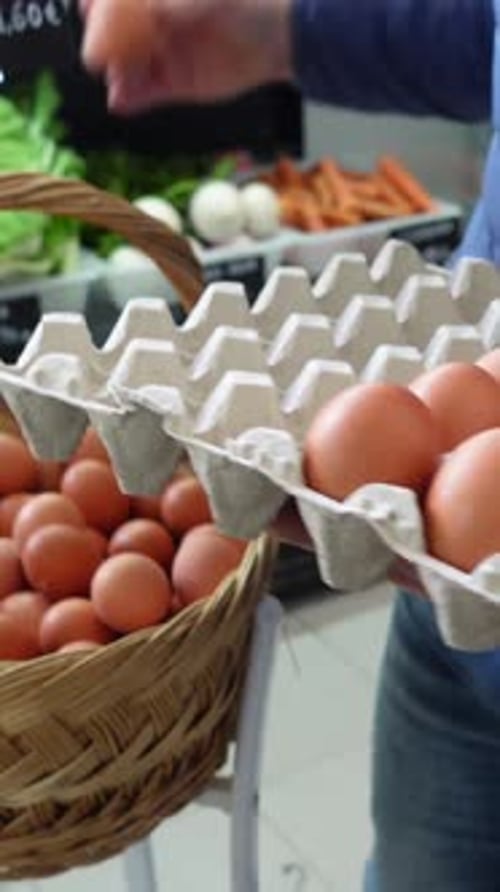 Selecting Fresh Eggs at Local Market