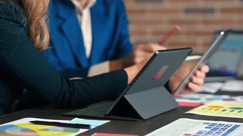Business session in an office. Woman and a man gesticulating
