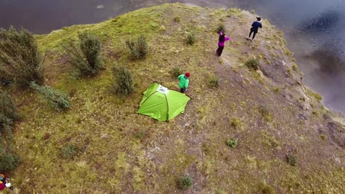 Campers Coming Out From The Tent Near The Lake In Huaraz, Peru. Aerial Drone Shot