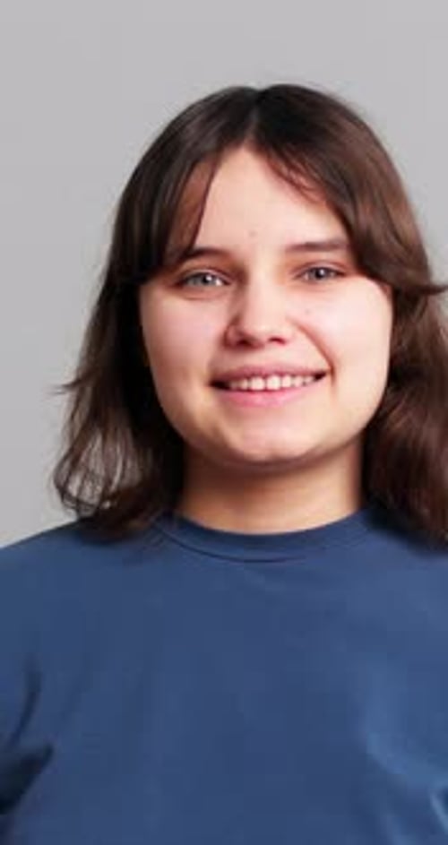 Smiling Teen in Studio with Brown Hair